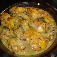 a pan filled with chicken and vegetables covered in gravy