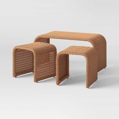 two tables made out of wicker sitting next to each other