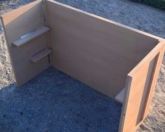 a wooden bench sitting on top of a gravel field