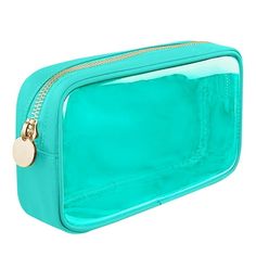 a turquoise colored cosmetic bag with gold zippers