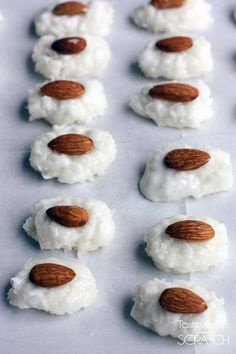 almonds and coconut on top of rice krispy kreme treats for dessert