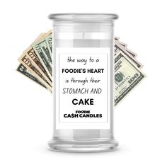 a glass jar filled with money and the words foodie's heart is through their stomach and cake