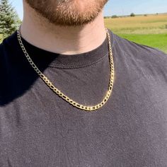 Introducing Our Gold Figaro Chain Necklace! This Stylish And Trendy Necklace Is Perfect For Any Outfit, Whether You're Dressing Up Or Dressing Down. Made Of Solid 316l Stainless Steel And Plated In 14k Gold, This Necklace Is Built To Last. It's Also Waterproof, Meaning It Won't Fade Or Tarnish Over Time. So Go Ahead And Show Off Your Style With Our Gold Figaro Chain Necklace! Real Solid 316l Stainless Steel 14k Gold Plating Waterproof Anti-Fade Anti-Tarnish No Green Neck Length: 22 Inch Width: 5 Gold Figaro Chain, Caged Necklace, Lava Bead Bracelet, Lapis Pendant, Skull Pendant Necklace, Figaro Chain Necklace, Trendy Necklace, Hematite Bracelet, Gold Chains For Men