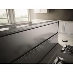 an image of a kitchen setting with stainless steel counter tops and appliances in the background