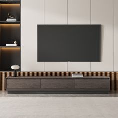 a large flat screen tv mounted to the side of a wall in a living room