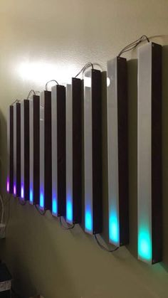 a row of lights that are on the side of a wall