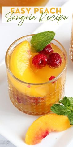 an easy peach sangria recipe with fresh fruit and mint garnish on top