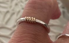 This beautiful mixed metal textured band is made from 14k gold or sterling silver ring is a unique design with its multi coloured metal detail. This simple ring is a super shiny and eye catching piece to add to your minimalist jewelry. This stackable boho style band looks beautiful by itself or layered with your other rings. This gorgeous ring makes a beautiful gift for her or him as a bridesmaid gift or even a wedding band. Please feel free to contact me regarding customizing this bracelet or a Etsy Rings, Bridesmaid Presents, Silversmithing Jewelry, Mixed Metal Rings, Hammered Ring, Gorgeous Ring, Stackable Bands, Simple Ring, Hammered Rings