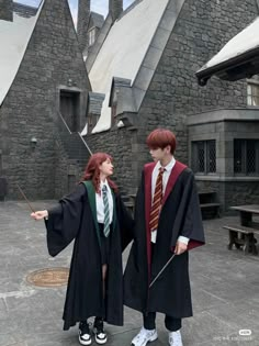 two people dressed up in harry potter costumes