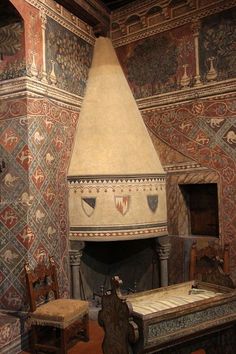 an old fireplace in the middle of a room