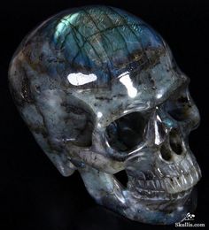 a crystal skull is shown on a black background