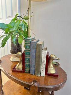 a table topped with books and a lamp