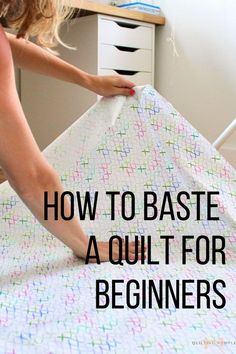 a woman ironing fabric with the words how to baste a quilt for beginners