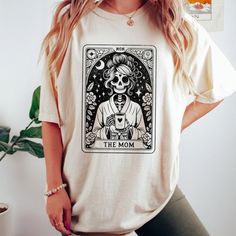 The Mom Tarot Card Shirt, Skeleton Mother T-Shirt. Product Description * Material: This T-Shirt Is Crafted From 100% Open-End Cotton, Ensuring Comfort And Durability. * Sizes: Available In A Range From S To 3xl, Finding Your Perfect Fit Is Easy. Check Out Our Comprehensive Sizing Chart In The Product Photos To Ensure The Ideal Size For You. Double-Check Your Selection Before Completing Your Purchase To Avoid Any Sizing Issues. * Processing: Your Order Will Be Securely Processed And Shipped Withi Mom Fits, Tarot Card Shirt, Silhouette Tutorials, Skeleton Shirt, Mom Tees, Christmas Day, Product Photos, Tarot Card, Sizing Chart