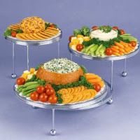 three tiered trays filled with different types of food