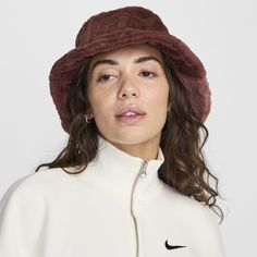 This bold bucket hat features an all-over Swoosh logo print embossed on ultraplush fur. Apex bucket hats all have a mid depth and 360-degree coverage. Red Leather Bucket Hat, Fuzzy Bucket Hat, Fur Bucket, Faux Fur Bucket Hat, Fur Bucket Hat, Swoosh Logo, Bucket Hats, Athletic Outfits, Outdoor Accessories