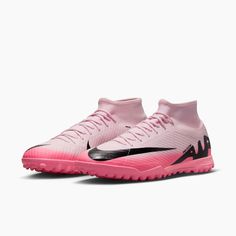 the nike merance soccer shoe in pink and black is shown on a white background