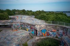 an abandoned building with graffiti all over it