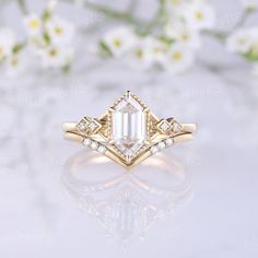 an image of a diamond ring with flowers in the background