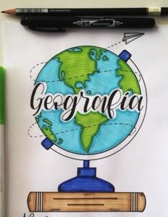 a drawing of a globe with the words geographia on it and a pencil