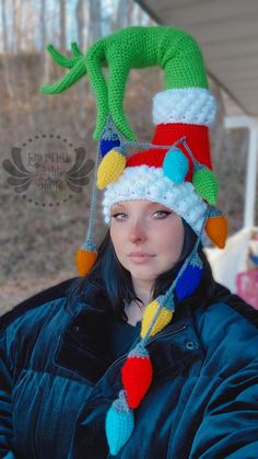 a woman wearing a crocheted elf hat