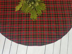 a plaid table cloth with a plant on it