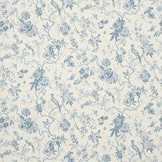 a blue and white floral wallpaper with small flowers on the bottom half of it