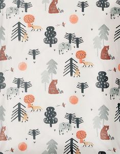 an animal themed sheet with trees and animals on it's side, as well as other things in the background