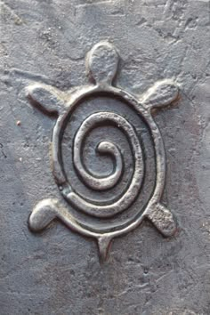 a stone with a spiral design on it