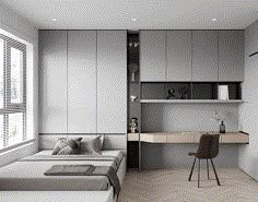 a bed sitting next to a desk in a bedroom