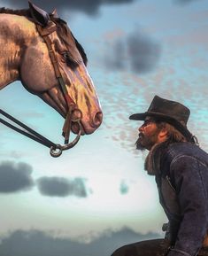 a man sitting on top of a horse next to a brown horse