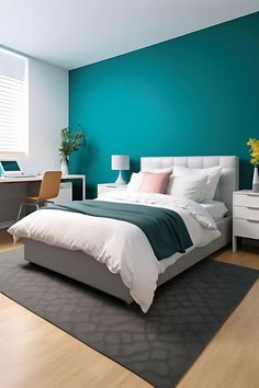 a bedroom with teal walls and white furniture