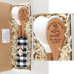 two wooden spoons in a gift box with the words expect sweet baby woman written on them