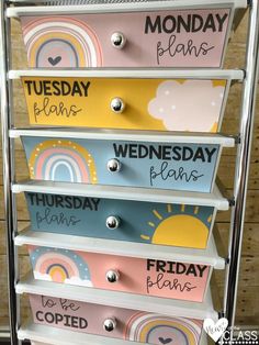 the drawers are painted with different colors and words on them, including days of the week