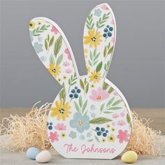 an easter bunny card with flowers and eggs