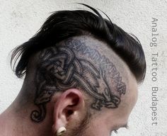 a man with a tattoo on his head