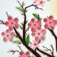 the paper flowers are made to look like branches