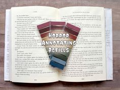 an open book with several different colors on it and the words horror annotating retells