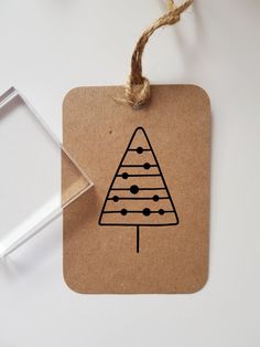 an ornament with a tree drawn on it