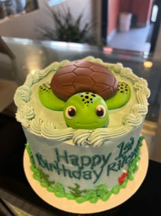 a birthday cake with a turtle on top