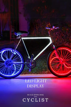 a bicycle with red, white and blue lights on it's front tire rims