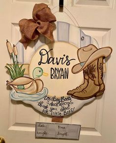 a door hanger that says, davis - bran with boots and flowers on it