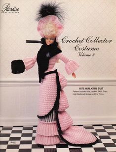 a crocheted doll is posed on a checkerboard floor with black and white tiles