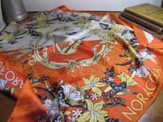 "This listing is for a vintage ladies Noracora silk scarf.  Musical instruments in the center surrounded by flowers and butterflies.  Scarf is orange, yellow, black and white.  Measures 21 1/2\" square.  Scarf is in good condition with only some minor fraying at the hem on the corners.  Bright colors. 062023" Music Scarf, Pale Pink Roses, Long Silk Scarf, Surrounded By Flowers, Silk Headscarf, Silk Scarf Painting, Pink And Blue Flowers, Hand Painted Silk Scarf, Vintage Silk Scarf