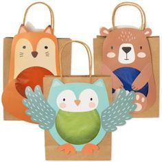 three bags with animals on them and one has an owl, fox, and bear design