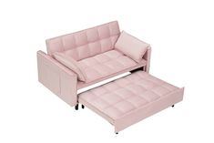 a pink couch and footstool sitting next to each other