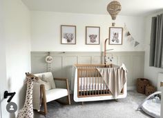 a baby's room with a crib, rocking chair and pictures on the wall