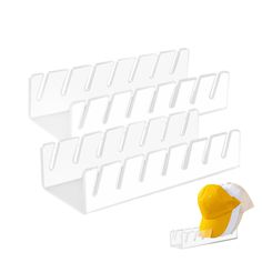 a white rack with two yellow hats on it