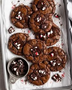 chocolate cookies with white and red sprinkles on top