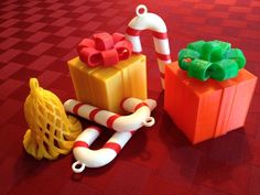 some candy canes and presents on a red table